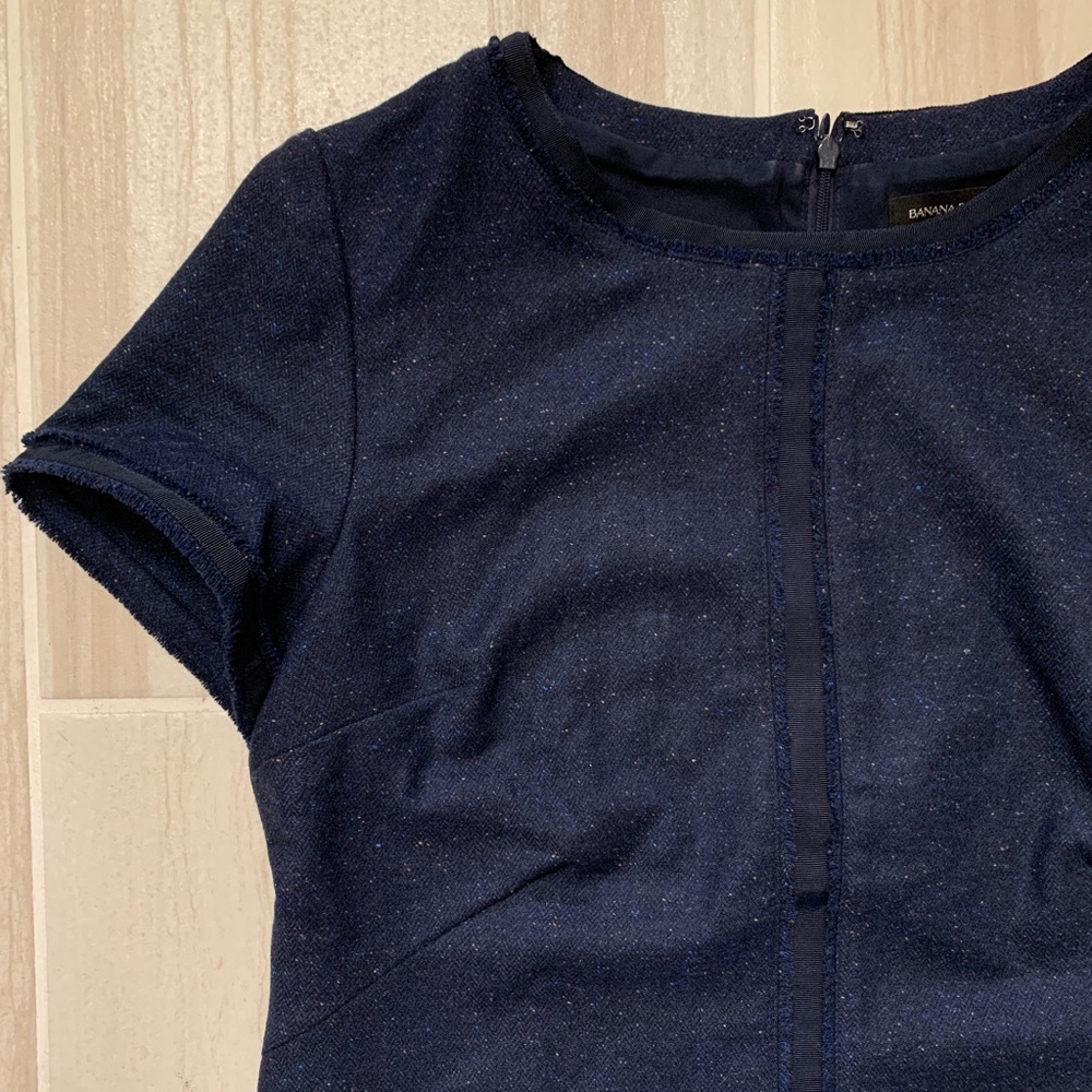 banana republic navy blue wool knit short sleeve blouse with fringe